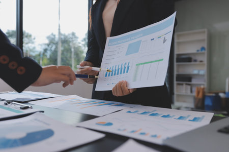 Team of business people working together in the meeting room office,
teamwork background charts and graphs banner, double exposure successful teamwork,business planning concept.の写真素材