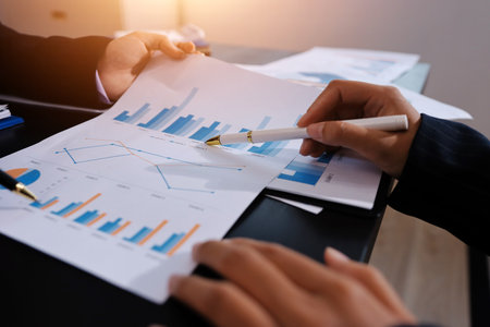 Team of business people working together in the meeting room office,
teamwork background charts and graphs banner, double exposure successful teamwork,business planning concept.の写真素材