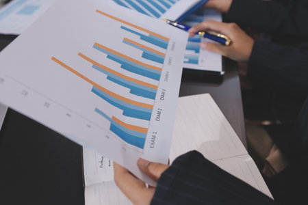 Team of business people working together in the meeting room office,
teamwork background charts and graphs banner, double exposure successful teamwork,business planning concept.の写真素材