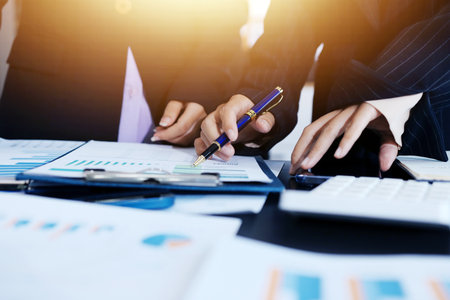 Team of business people working together in the meeting room office,
teamwork background charts and graphs banner, double exposure successful teamwork,business planning concept.の写真素材