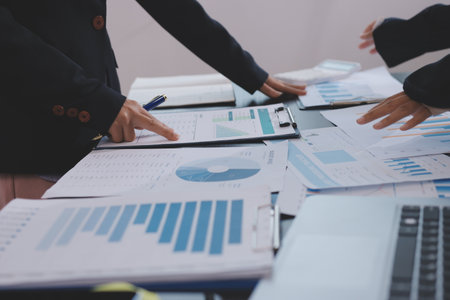 Team of business people working together in the meeting room office,
teamwork background charts and graphs banner, double exposure successful teamwork,business planning concept.の写真素材