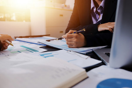 Team of business people working together in the meeting room office,
teamwork background charts and graphs banner, double exposure successful teamwork,business planning concept.の写真素材