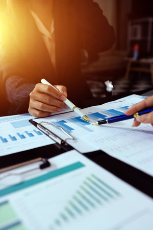 Team of business people working together in the meeting room office,
teamwork background charts and graphs banner, double exposure successful teamwork,business planning concept.の写真素材