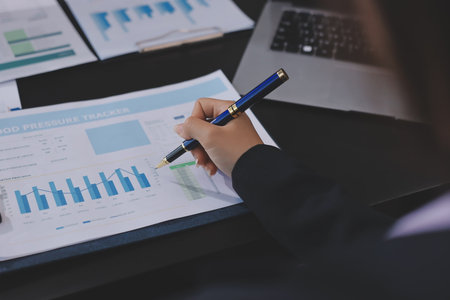 Team of business people working together in the meeting room office,
teamwork background charts and graphs banner, double exposure successful teamwork,business planning concept.の写真素材