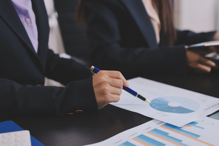 Team of business people working together in the meeting room office,
teamwork background charts and graphs banner, double exposure successful teamwork,business planning concept.の写真素材
