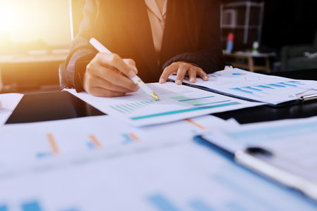 Team of business people working together in the meeting room office,
teamwork background charts and graphs banner, double exposure successful teamwork,business planning concept.の写真素材