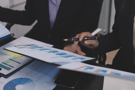 Team of business people working together in the meeting room office,
teamwork background charts and graphs banner, double exposure successful teamwork,business planning concept.の写真素材