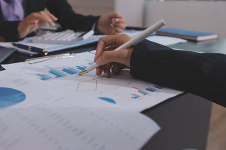 Team of business people working together in the meeting room office,
teamwork background charts and graphs banner, double exposure successful teamwork,business planning concept.の写真素材
