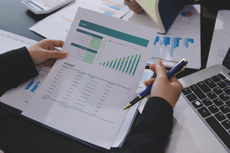 Team of business people working together in the meeting room office,
teamwork background charts and graphs banner, double exposure successful teamwork,business planning concept.の写真素材