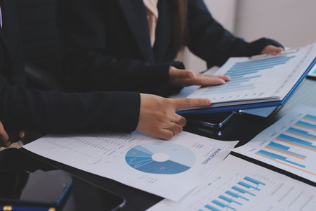 Team of business people working together in the meeting room office,
teamwork background charts and graphs banner, double exposure successful teamwork,business planning concept.の写真素材