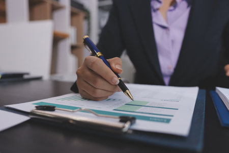 Team of business people working together in the meeting room office,
teamwork background charts and graphs banner, double exposure successful teamwork,business planning concept.の写真素材