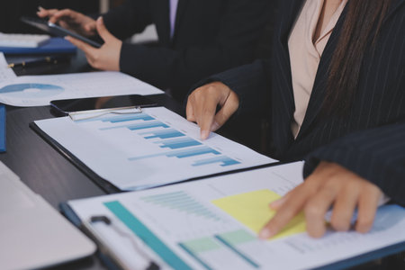 Team of business people working together in the meeting room office,
teamwork background charts and graphs banner, double exposure successful teamwork,business planning concept.の写真素材