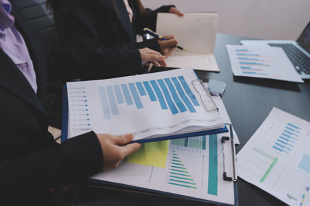 Team of business people working together in the meeting room office,
teamwork background charts and graphs banner, double exposure successful teamwork,business planning concept.の写真素材