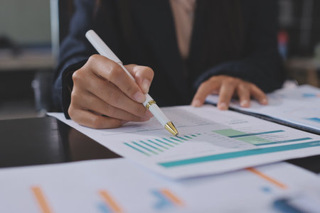 Team of business people working together in the meeting room office,
teamwork background charts and graphs banner, double exposure successful teamwork,business planning concept.の写真素材