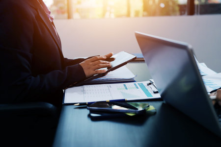 Team of business people working together in the meeting room office,
teamwork background charts and graphs banner, double exposure successful teamwork,business planning concept.の写真素材