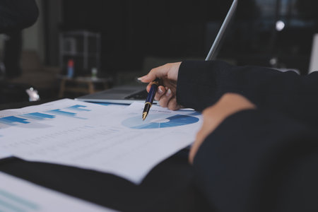 Team of business people working together in the meeting room office,
teamwork background charts and graphs banner, double exposure successful teamwork,business planning concept.の写真素材