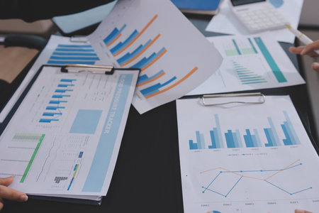 Team of business people working together in the meeting room office,
teamwork background charts and graphs banner, double exposure successful teamwork,business planning concept.の写真素材