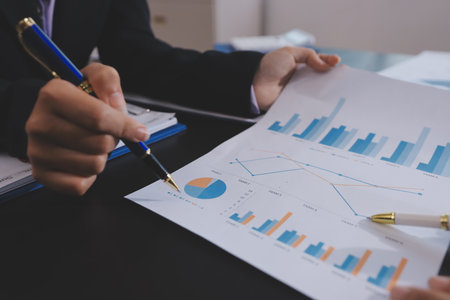 Team of business people working together in the meeting room office,
teamwork background charts and graphs banner, double exposure successful teamwork,business planning concept.の写真素材