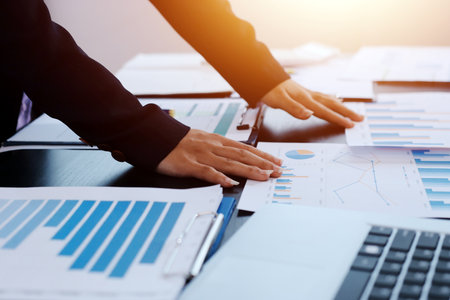 Team of business people working together in the meeting room office,
teamwork background charts and graphs banner, double exposure successful teamwork,business planning concept.の写真素材