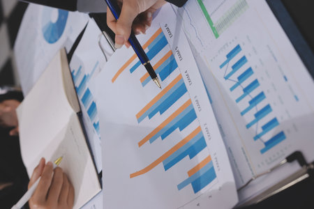 Team of business people working together in the meeting room office,
teamwork background charts and graphs banner, double exposure successful teamwork,business planning concept.の写真素材