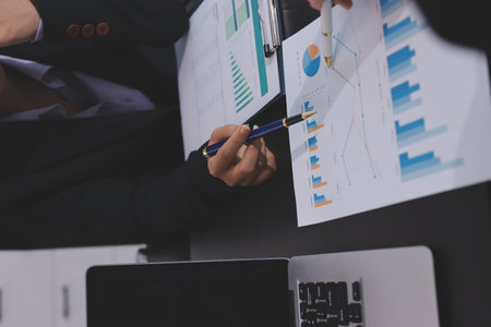 Team of business people working together in the meeting room office,
teamwork background charts and graphs banner, double exposure successful teamwork,business planning concept.の写真素材