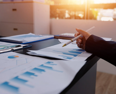 Team of business people working together in the meeting room office,
teamwork background charts and graphs banner, double exposure successful teamwork,business planning concept.の写真素材