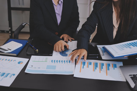 Team of business people working together in the meeting room office,
teamwork background charts and graphs banner, double exposure successful teamwork,business planning concept.の写真素材