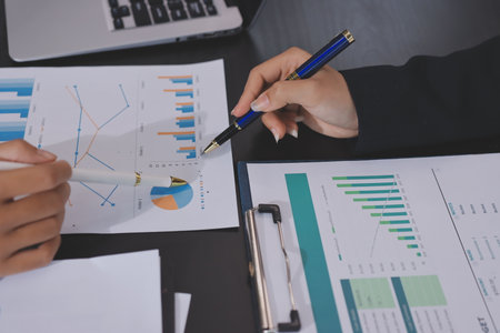 Team of business people working together in the meeting room office,
teamwork background charts and graphs banner, double exposure successful teamwork,business planning concept.の写真素材