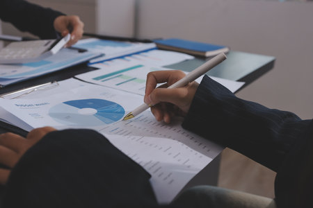 Team of business people working together in the meeting room office,
teamwork background charts and graphs banner, double exposure successful teamwork,business planning concept.の写真素材