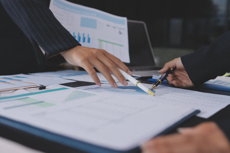 Team of business people working together in the meeting room office,
teamwork background charts and graphs banner, double exposure successful teamwork,business planning concept.の写真素材