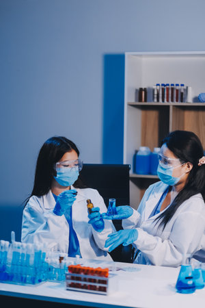Research, experiment and medical trial being done by a scientist in a lab, science facility or hospital. One young, serious and professional researcher organizing, sorting or making a discoveryの写真素材