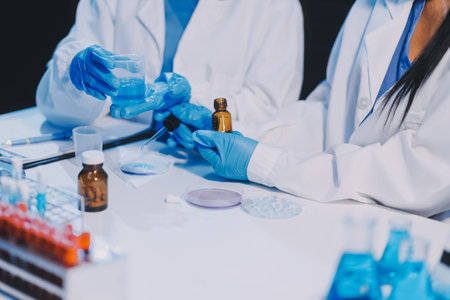 Research, experiment and medical trial being done by a scientist in a lab, science facility or hospital. One young, serious and professional researcher organizing, sorting or making a discoveryの写真素材