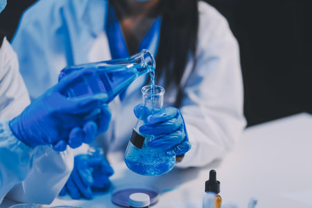 Research, experiment and medical trial being done by a scientist in a lab, science facility or hospital. One young, serious and professional researcher organizing, sorting or making a discoveryの写真素材