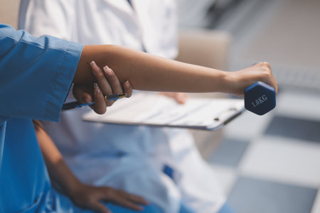 Unrecognizable uses blue hand weight during physical therapy session