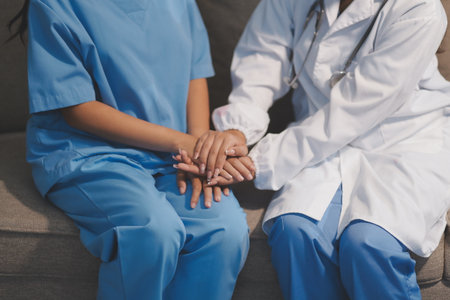 Close up images, The doctor holding hands patient to give advice and encourage To fight the disease And cheer to receive treatment, to elderly patient and health care concept.の写真素材