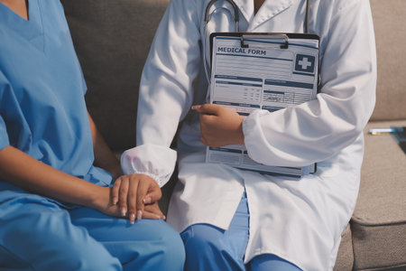 Close up images, The doctor holding hands patient to give advice and encourage To fight the disease And cheer to receive treatment, to elderly patient and health care concept.の写真素材