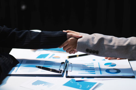 Business partnership meeting concept, Two confident Business handshake and business people after discussing good deal of Trading contract and new projects for both companies, success, partnership.の写真素材