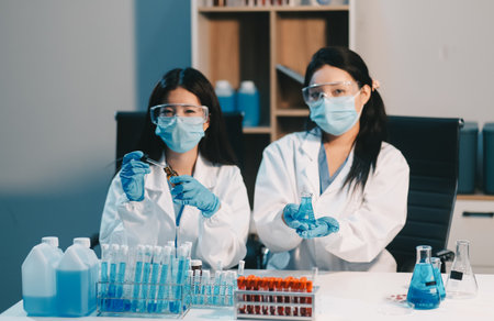 Research, experiment and medical trial being done by a scientist in a lab, science facility or hospital. One young, serious and professional researcher organizing, sorting or making a discoveryの写真素材
