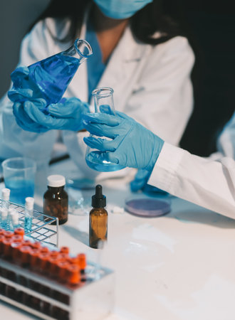 Research, experiment and medical trial being done by a scientist in a lab, science facility or hospital. One young, serious and professional researcher organizing, sorting or making a discoveryの写真素材