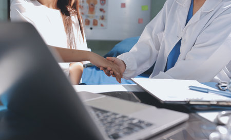 The doctor is checking and encouraging the patient.の写真素材