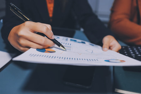 Business Documents, Auditor businesswoman checking searching document legal prepare paperwork or report for analysis TAX time,accountant Documents data contract partner deal in workplace officeの写真素材