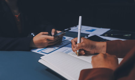 Business Documents, Auditor businesswoman checking searching document legal prepare paperwork or report for analysis TAX time,accountant Documents data contract partner deal in workplace officeの写真素材
