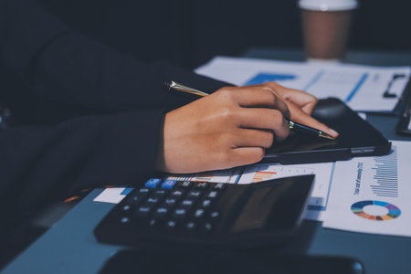 Business Documents, Auditor businesswoman checking searching document legal prepare paperwork or report for analysis TAX time,accountant Documents data contract partner deal in workplace officeの写真素材