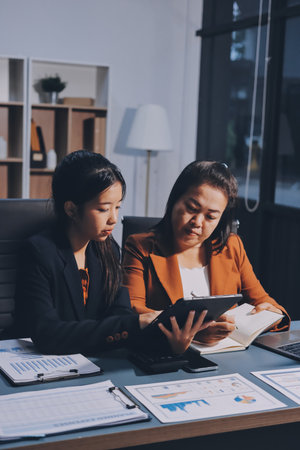 Business Documents, Auditor businesswoman checking searching document legal prepare paperwork or report for analysis TAX time,accountant Documents data contract partner deal in workplace officeの写真素材