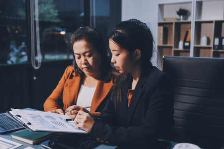 Business Documents, Auditor businesswoman checking searching document legal prepare paperwork or report for analysis TAX time,accountant Documents data contract partner deal in workplace officeの写真素材