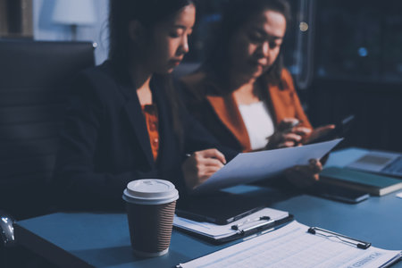 Business Documents, Auditor businesswoman checking searching document legal prepare paperwork or report for analysis TAX time,accountant Documents data contract partner deal in workplace officeの写真素材
