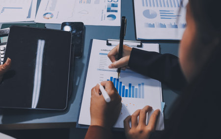 Business Documents, Auditor businesswoman checking searching document legal prepare paperwork or report for analysis TAX time,accountant Documents data contract partner deal in workplace officeの写真素材