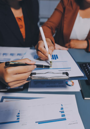 Business Documents, Auditor businesswoman checking searching document legal prepare paperwork or report for analysis TAX time,accountant Documents data contract partner deal in workplace officeの写真素材