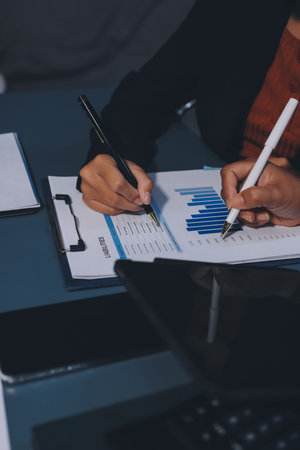 Business Documents, Auditor businesswoman checking searching document legal prepare paperwork or report for analysis TAX time,accountant Documents data contract partner deal in workplace officeの写真素材