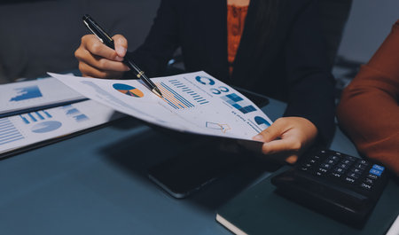 Business Documents, Auditor businesswoman checking searching document legal prepare paperwork or report for analysis TAX time,accountant Documents data contract partner deal in workplace officeの写真素材